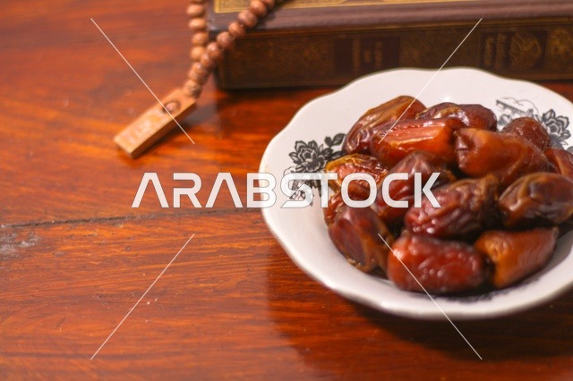 Traditional Ramadan Dates and Prayer Beads on Wood