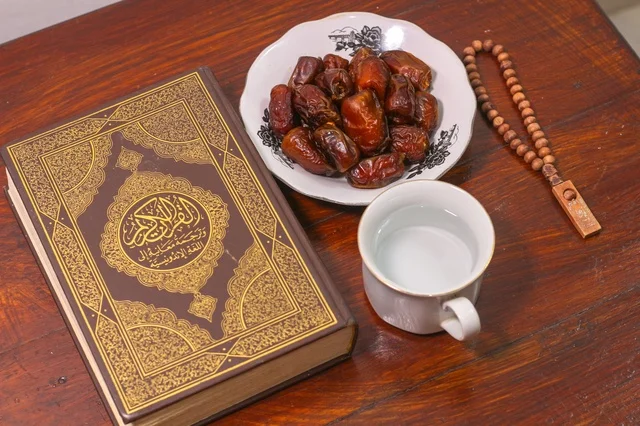 Quran and Dates on Wooden Table for Ramadan