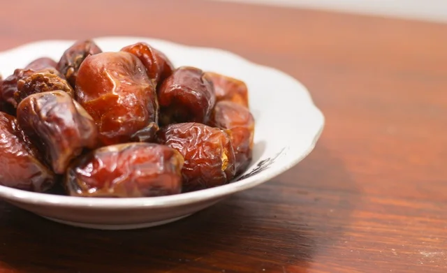 Dried Dates on White Plate for Ramadan Iftar Dried Dates on White Plate for Ramadan Iftar