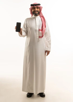 Saudi Man in Traditional Thobe Holding Smartphone