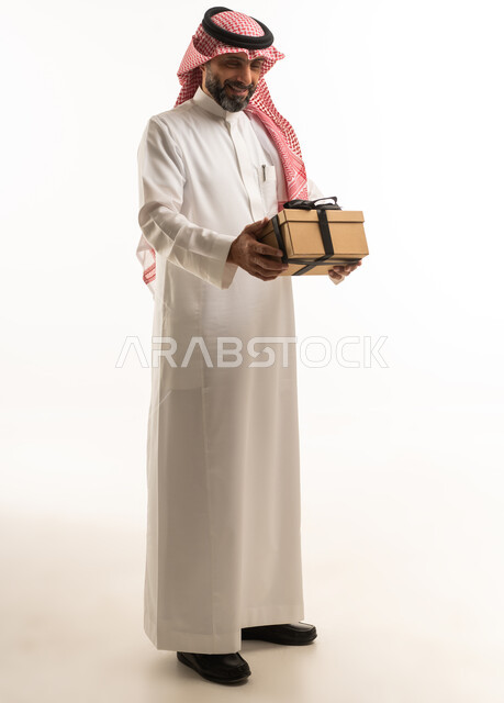 Saudi Man Holding Gift Box on White Background