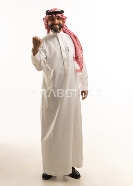 Saudi Man in Traditional Thobe Celebrating Success