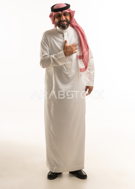 Saudi Man in Traditional Dress with Hand on Chest