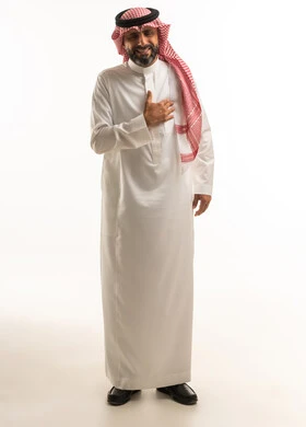 Saudi Man in Traditional Dress with Hand on Chest