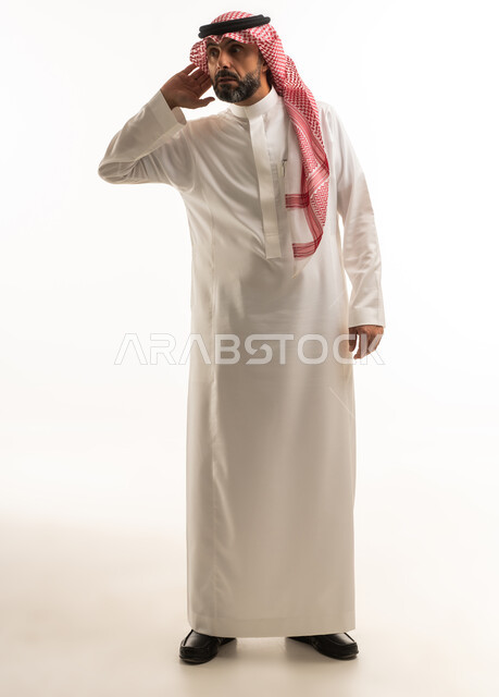 Saudi Man in Traditional Thobe Listening Gesture