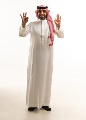 Saudi Man in Traditional Thobe Giving Okay Gesture