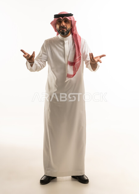 Saudi Man in Traditional Thobe Making Hand Gestures