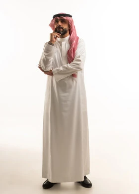 Saudi Man in Traditional Thobe Thinking in Studio