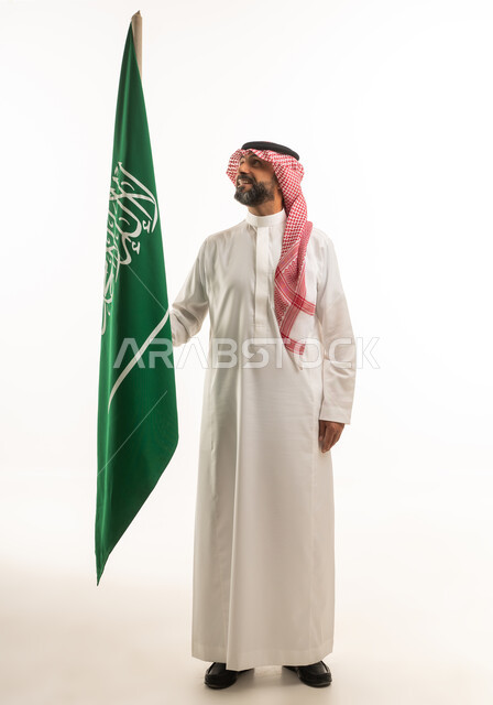Saudi Man Holding Saudi Arabia Flag on White Background