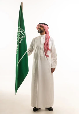 Saudi Man Holding Saudi Arabia Flag on White Background