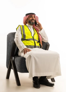 Saudi Engineer in Safety Vest Talking on Phone