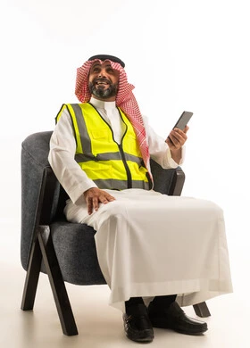 Saudi Engineer in Safety Vest with Smartphone