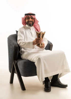 Saudi Man in Traditional Dress Holding Incense Burner