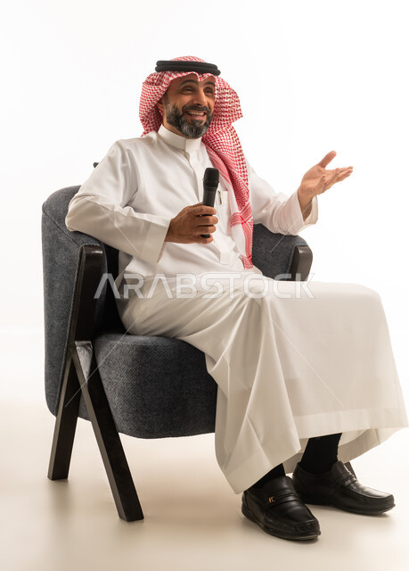 Saudi Man with Microphone Interviewing in Studio