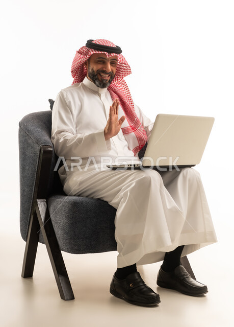 Saudi Man Using Laptop for Video Call
