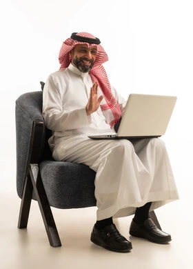 Saudi Man Using Laptop for Video Call