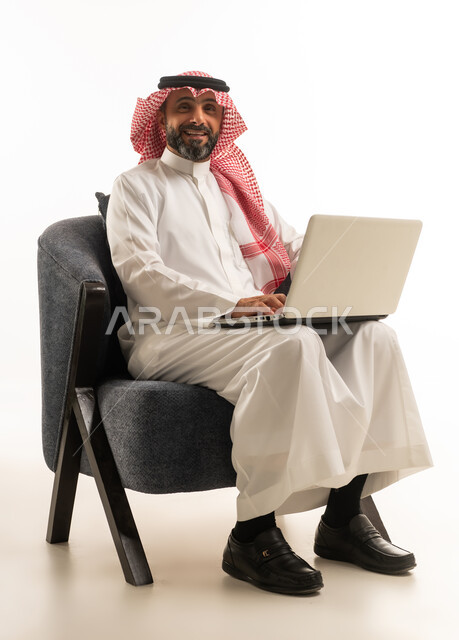 Saudi Businessman with Laptop on White Background