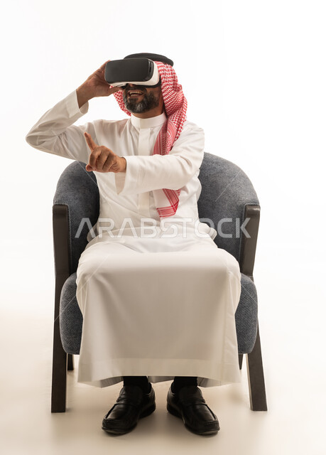 Saudi Man Wearing VR Headset in White Studio