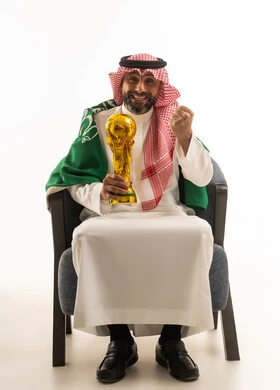 Saudi Man Holding Gold Trophy with National Flag