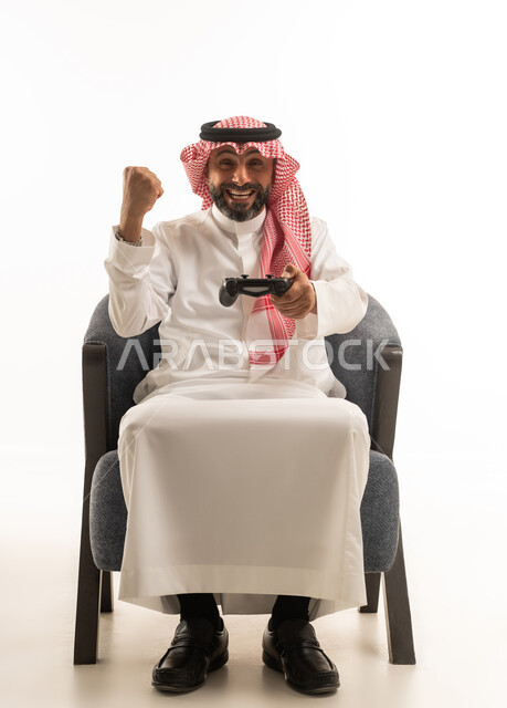 Saudi Man Playing Video Games and Celebrating