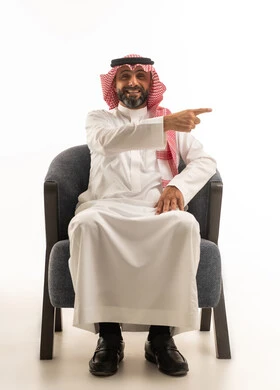 Saudi Man in Traditional Thobe Pointing Sideways