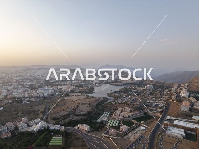 مشهد جوي لبحيرة سد أبها وجبال عسير