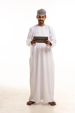 Omani Man Using Digital Tablet on White Background