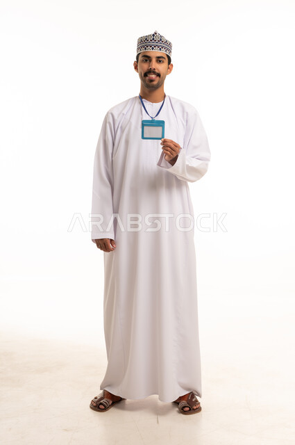 Omani Man in Traditional Dress Holding Identity Badge