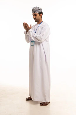 Omani Man Praying in Traditional Dress on White Background