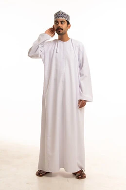 Omani Man in Traditional Dishdasha Listening Gesture