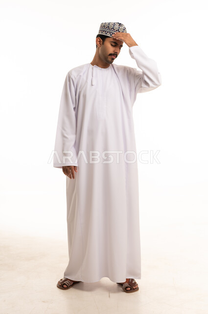 Omani Man in Traditional Dress with Headache