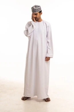 Omani Man in Traditional Dress with Headache