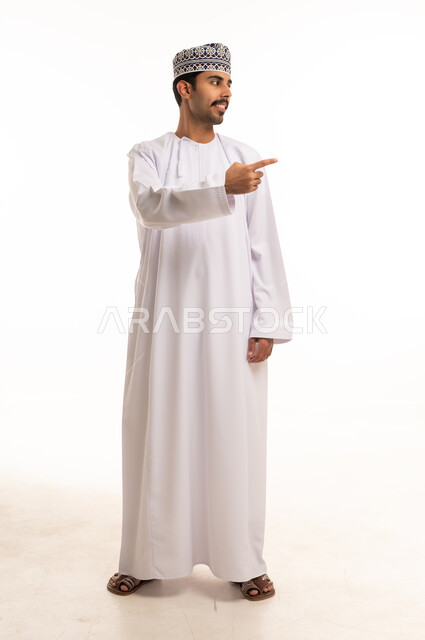 Omani Man Pointing in Traditional Dress White Background