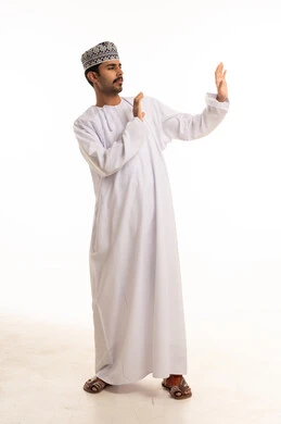 Omani Man in Traditional Dress Making Defensive Gesture