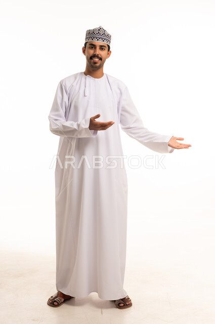 Omani Man in Traditional Dishdasha Gesturing in Studio