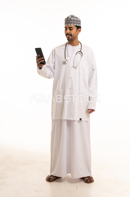 Omani Doctor in White Coat with Smartphone