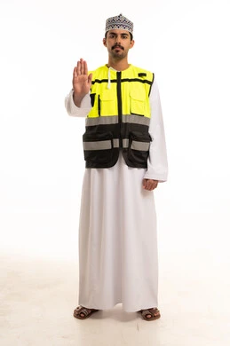 Omani Man in Safety Vest Making Stop Gesture