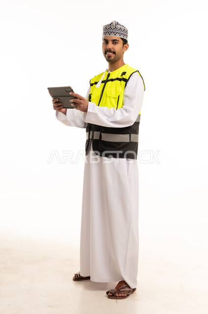 Omani Engineer with Tablet in Safety Vest