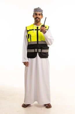 Omani Man in Safety Vest with Walkie Talkie