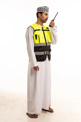 Omani Man in Safety Vest Using Walkie-Talkie Studio