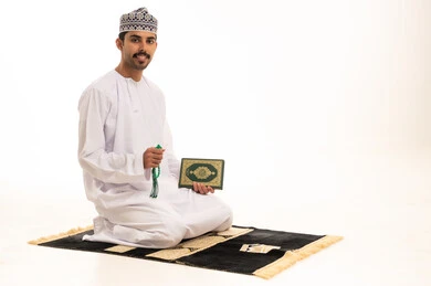 Omani Man with Quran and Prayer Beads