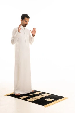 Saudi Man in Thobe Performing Prayer on White Background