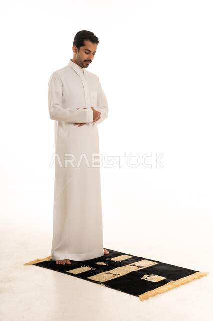 Saudi Man Performing Salah on Prayer Rug