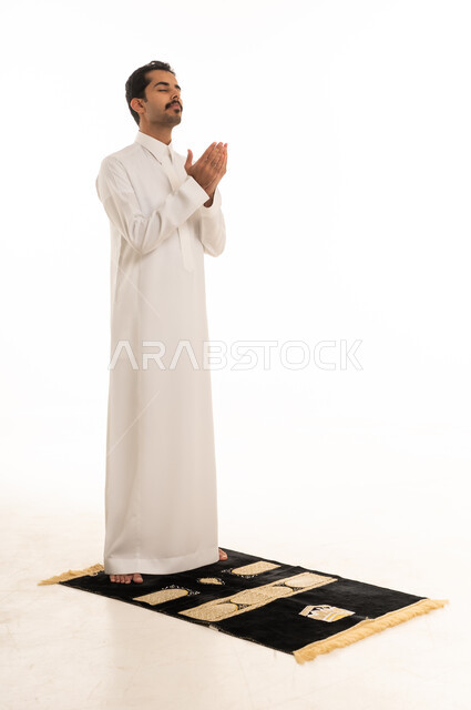 Saudi Man Praying on Rug Supplication White Background
