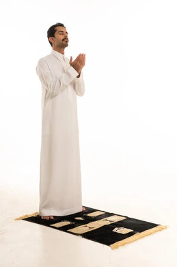 Saudi Man Praying on Rug Supplication White Background