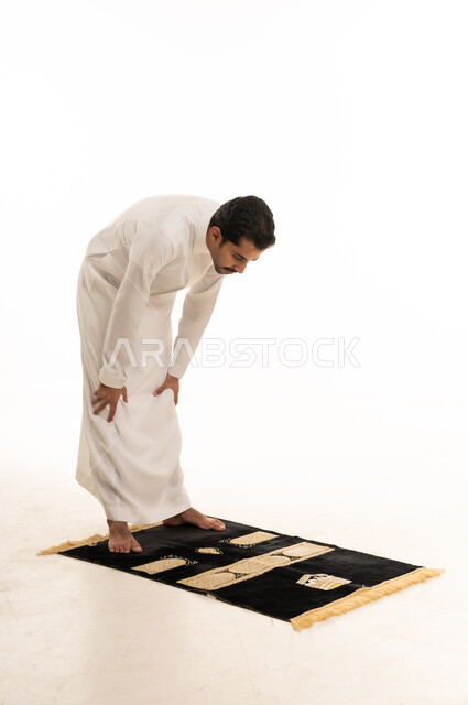 Saudi Man Performing Ruku Prayer Position in Studio