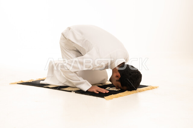 Saudi Man in Sujud Position on White Background