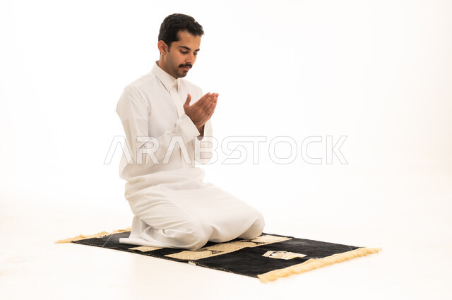 Saudi Man Performing Dua on White Background