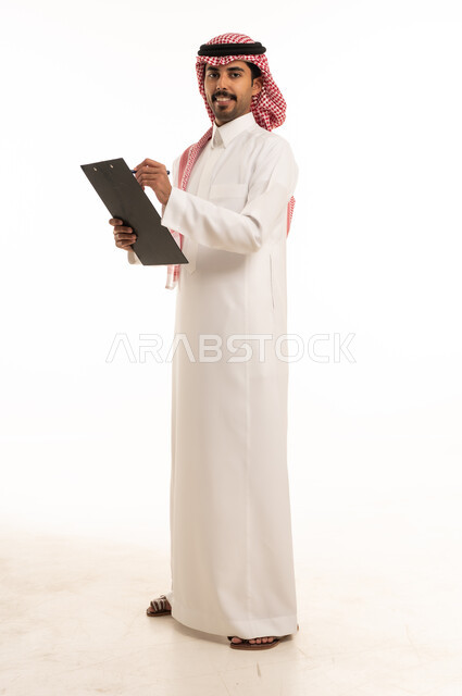Saudi Man in Traditional Thobe Holding Clipboard