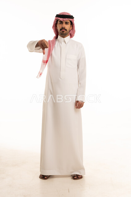 Saudi Man Giving Thumbs Down Gesture on White Background